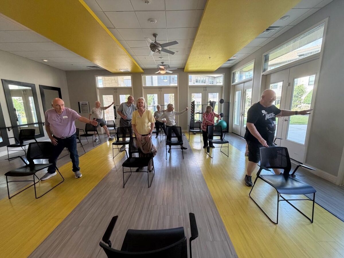 Standing dance and movement class at a senior living community