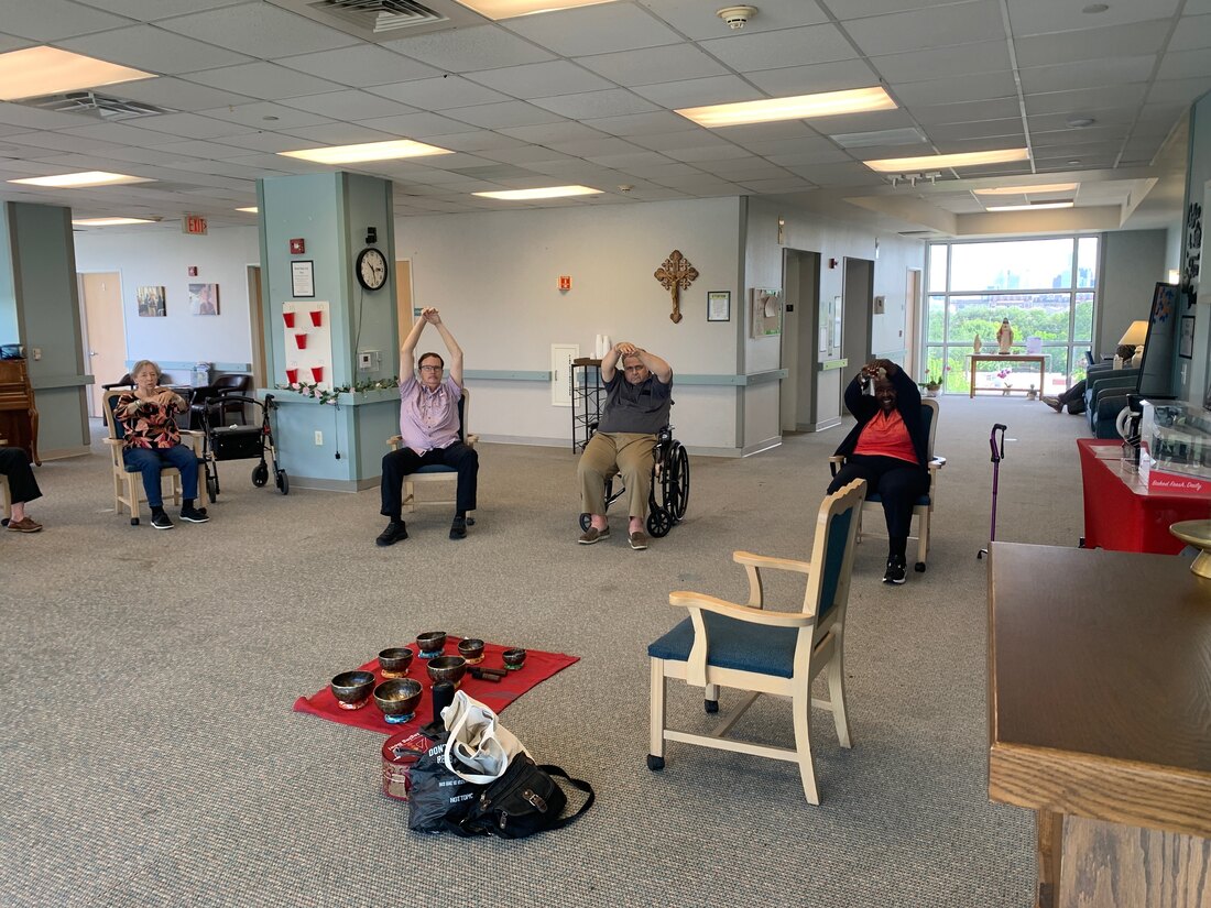 Residents in an Orion wellness class at a memory care community