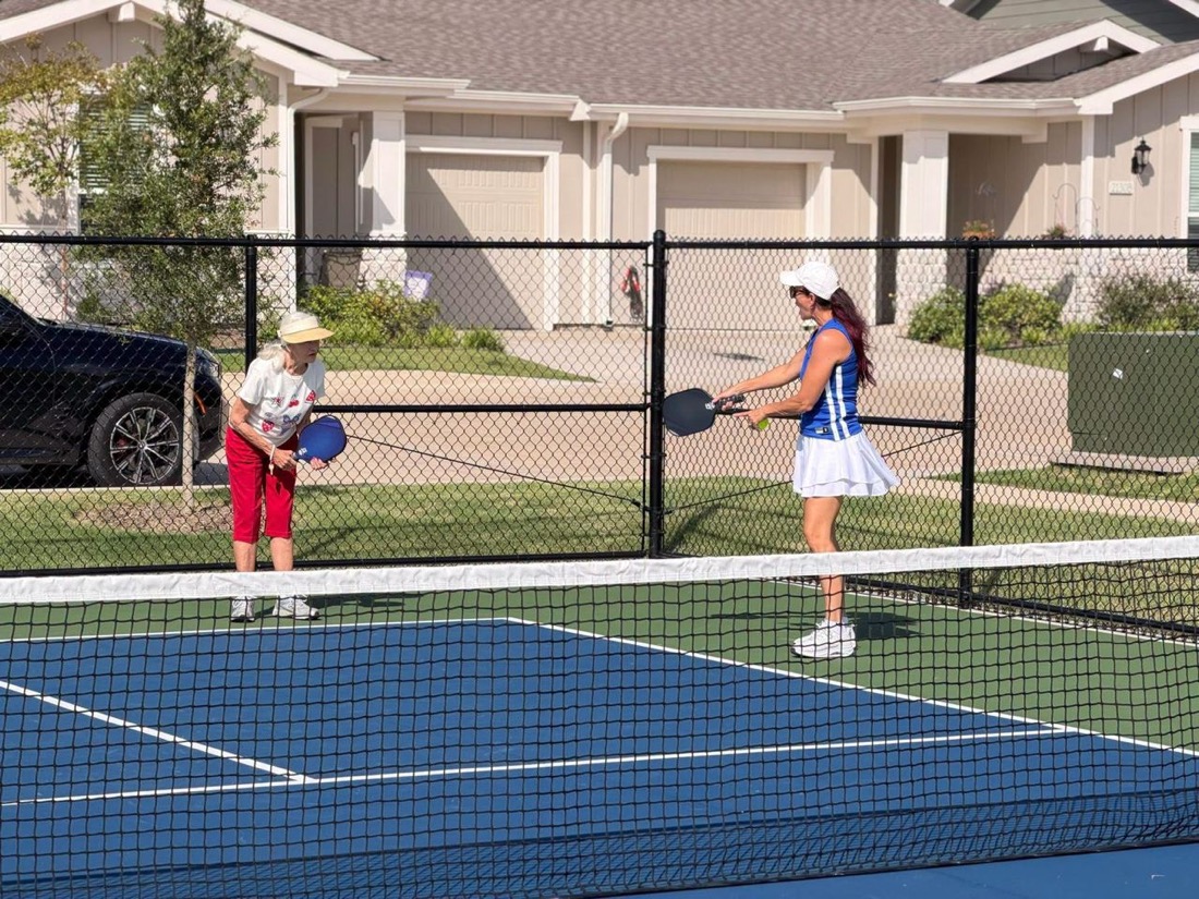 Seniors playing pickleball