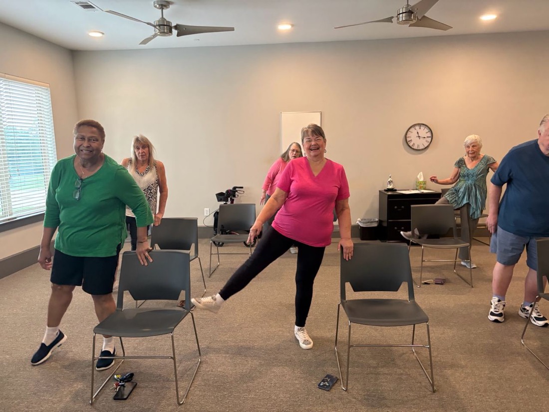 Senior doing a standing movement exercise